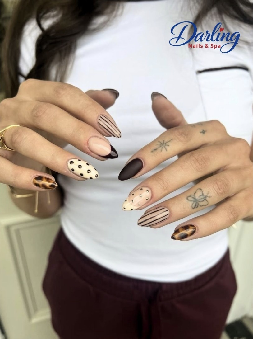 Brown and neutral autumn nails with delicate floral details