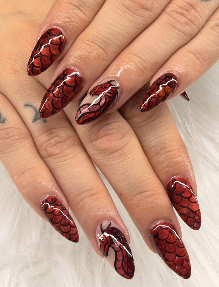Red dragon scale nail art with silver accents
