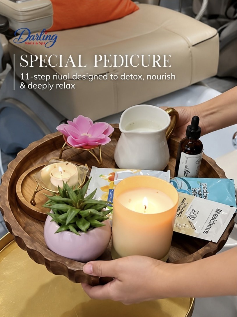 Special pedicure tray with fresh ingredients, flowers and a candle