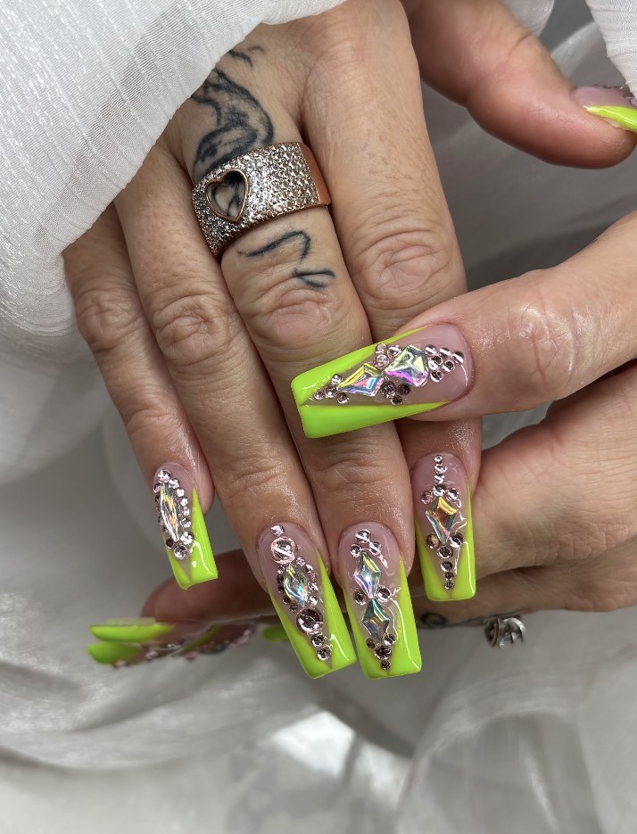Neon green French tips with crystal embellishments